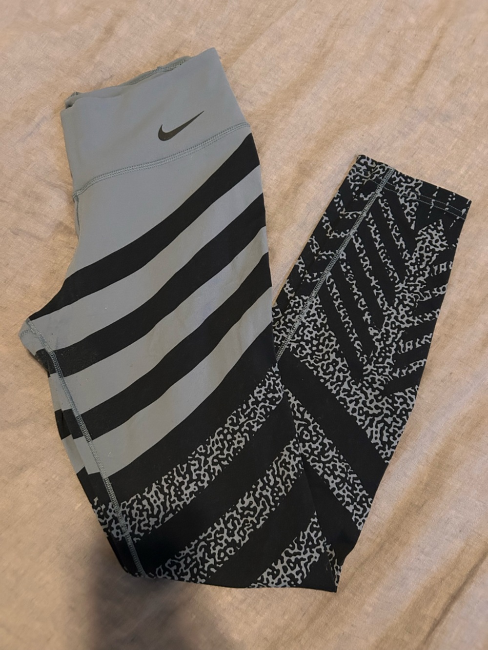 Nike women’s Black and Gray leggings with Mixed Stripe and Abstract Panels